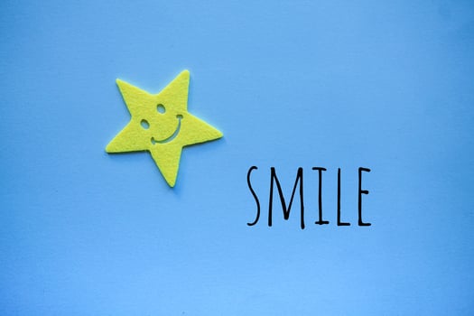 smile emotion on the blue background photo