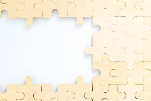 wooden jigsaw puzzle pieces on white background photo