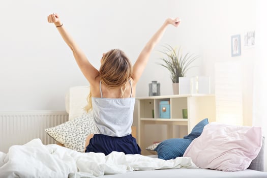 Happy woman stretching in the morning photo