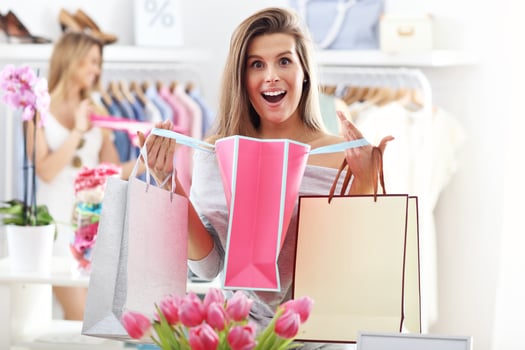 Happy woman shopping for shoes photo
