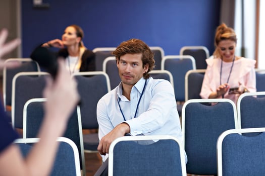 Young bored people sitting in conference room photo