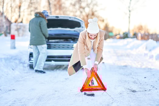 Couple having problem with the car during winter trip photo