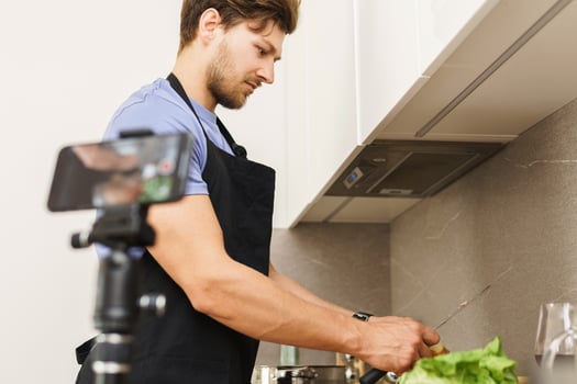 Chef blogger is peeling onions for lunch photo