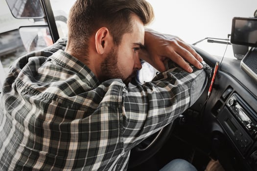 Tired truck driver feeling sleepy and sick photo