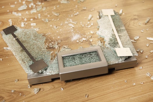 Overweight concept. Cracked glass weighing scale photo