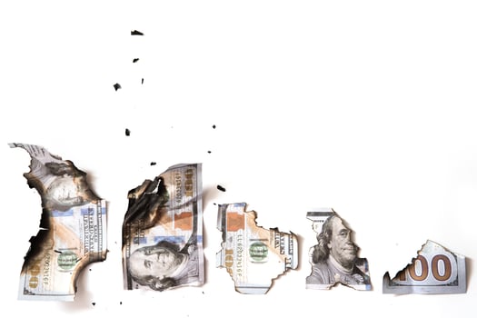 Burnt one hundred dollar bills after a fire. photo