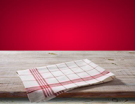 White napkin, table cloth on wooden deck mockup. photo