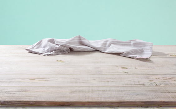 White napkin, table cloth on wooden deck mockup. photo