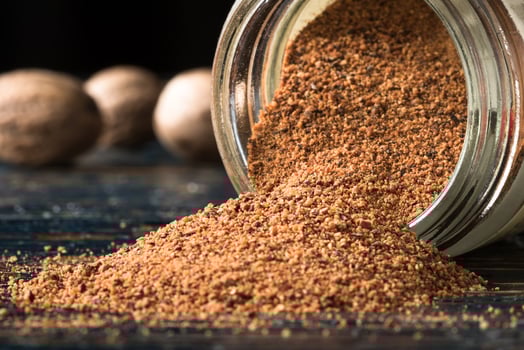 Ground Nutmeg Spilled from a Jar photo