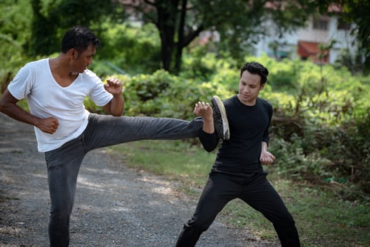 Young man training self defense fighting technique. photo