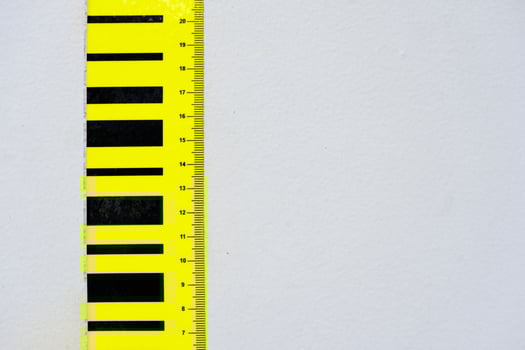 Centimeter Scale on White Concrete Wall Background. photo