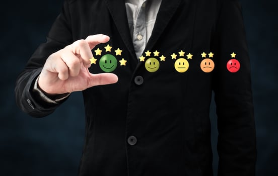 person hand choose happy smile face icon and five star symbol to increase rating of product and service concept, Customer service experience and business satisfaction survey. photo