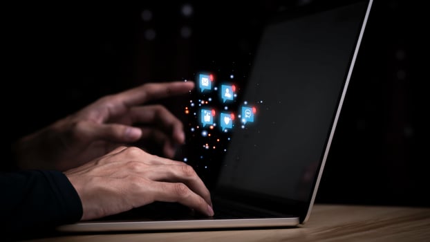 Concept with notification icons of like being happy.and social media interactions on laptop,message, email, comment ,businessman hands holding device,smartphone, internet digital marketing. photo