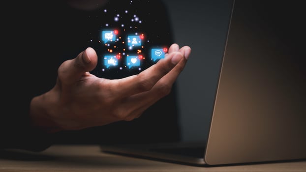 Concept with notification icons of like being happy.and social media interactions on laptop,message, email, comment ,businessman hands holding device,smartphone, internet digital marketing. photo