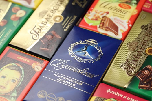 KHARKIV, UKRAINE - JANUARY 27, 2022 Bunch of famous russian chocolate products - Babayevskiy chocolate, Vdokhnovenie and Alyonka. Old russian traditional chocolate photo