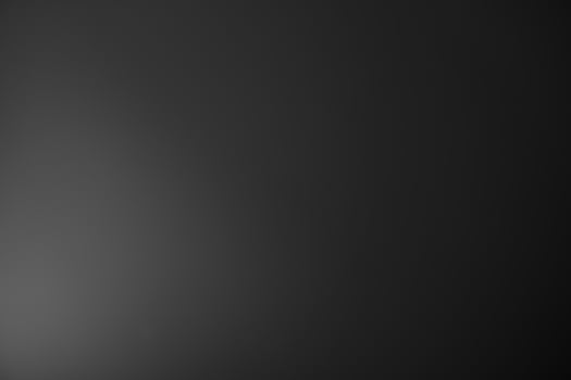 Dark black and gray blurred gradient background has a little abstract light. soft background for wallpaper,design,graphic and presentation, backdrop wall photo