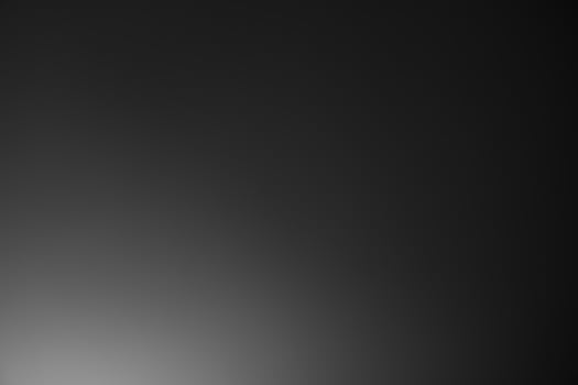 Dark black and gray blurred gradient background has a little abstract light. soft background for wallpaper,design,graphic and presentation, backdrop wall photo