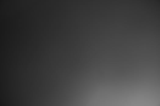 Dark black and gray blurred gradient background has a little abstract light. soft background for wallpaper,design,graphic and presentation, backdrop wall photo