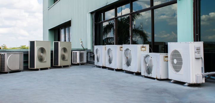 Air compressor on rooftop building photo