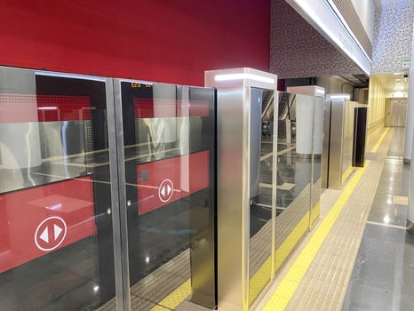 Automatic door platform system at a new modern metro station. Metro security system glass beautiful doors open synchronously with the doors of the arriving train car photo