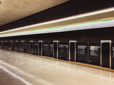 New modern safety screen with sliding doors for the safety of the metro train in the big city on the waiting platform in the metro station at the train station photo