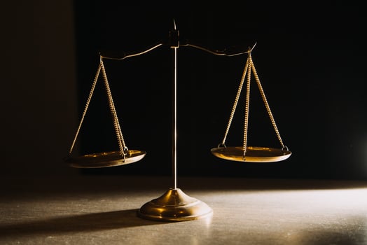 Business and lawyers discussing contract papers with brass scale on desk in office. Law, legal services, advice, justice and law concept picture with film grain effect photo