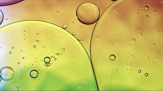 Abstract Colorful Food Oil Drops Bubbles and spheres Flowing on Water Surface photo