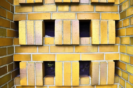 Detailed view at a colorful old and weathered brick wall texture as a panoramic background. photo