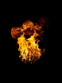 real and hot flames are burning on a black background. photo