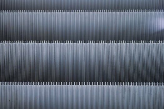 Abstract Shiny Gray pattern of metal escalator foot step texture background photo