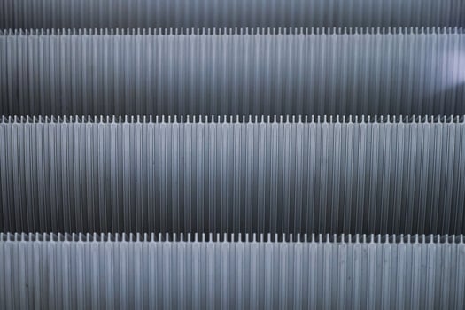 Abstract Shiny Gray pattern of metal escalator foot step texture background photo