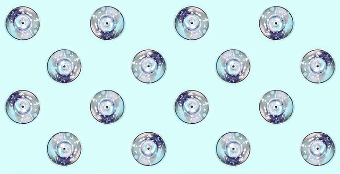 Many used spray cans for graffiti drawing lies on a pastel colored backgroung. Street art painting concept. Minimal flat lay pattern. Top view photo