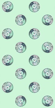Many used spray cans for graffiti drawing lies on a pastel colored backgroung. Street art painting concept. Minimal flat lay pattern. Top view photo