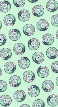 Many used spray cans for graffiti drawing lies on a pastel colored backgroung. Street art painting concept. Minimal flat lay pattern. Top view photo