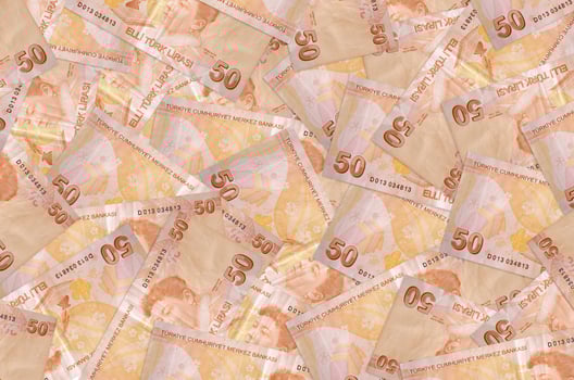 50 Turkish liras bills lies in big pile. Rich life conceptual background photo