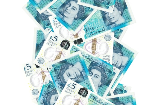 5 British pounds bills flying down isolated on white. Many banknotes falling with white copyspace on left and right side photo