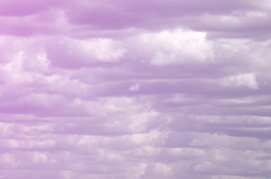 A blue sky with lots of white clouds of different sizes photo