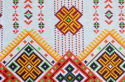 Traditional Ukrainian folk art knitted embroidery pattern on textile fabric photo
