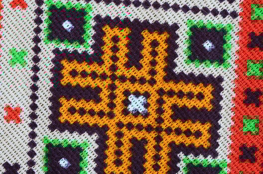 Traditional Ukrainian folk art knitted embroidery pattern on textile fabric photo