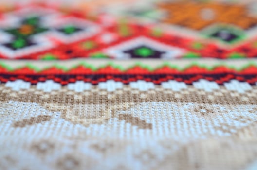 Traditional Ukrainian folk art knitted embroidery pattern on textile fabric photo