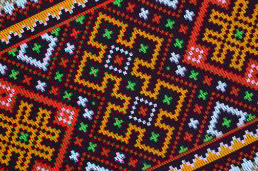 Traditional Ukrainian folk art knitted embroidery pattern on textile fabric photo