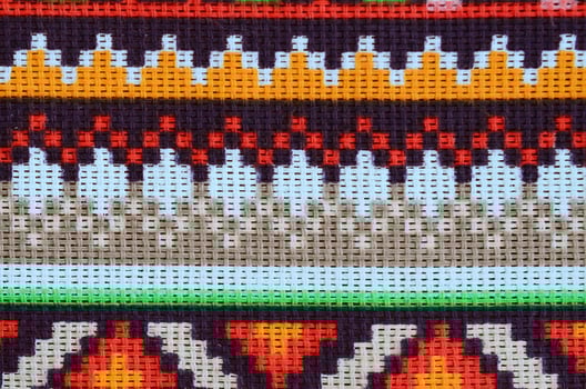 Traditional Ukrainian folk art knitted embroidery pattern on textile fabric photo