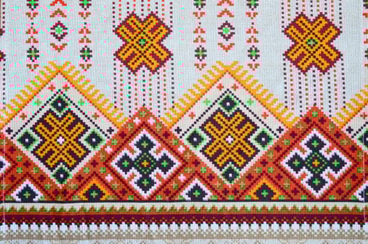 Traditional Ukrainian folk art knitted embroidery pattern on textile fabric photo