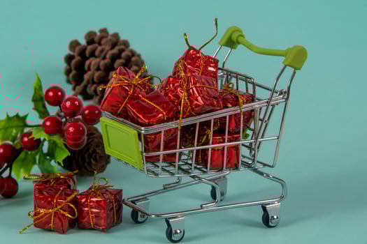 Christmas shopping cart with gifts and Christmas photo
