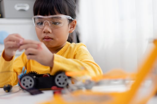 Asia students learn at home in coding robot cars and electronic board cables in STEM, STEAM, mathematics engineering science technology computer code in robotics for kids concept. photo