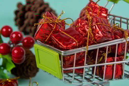 Christmas shopping cart with gifts and Christmas photo