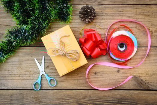 diy gift concept - Homemade wrapped christmas presents with tools and decorations on wooden , DIY hobby gift box wrapped brown paper collection in for christmas or new year photo