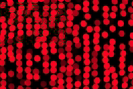 Unfocused abstract red bokeh on black background. defocused and blurred many round light photo