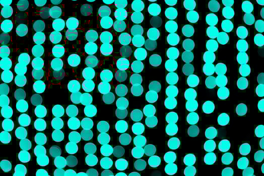 Unfocused abstract colourful bokeh black background. defocused and blurred many round blue light photo