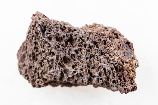 Pumice of basic composition stone on white photo